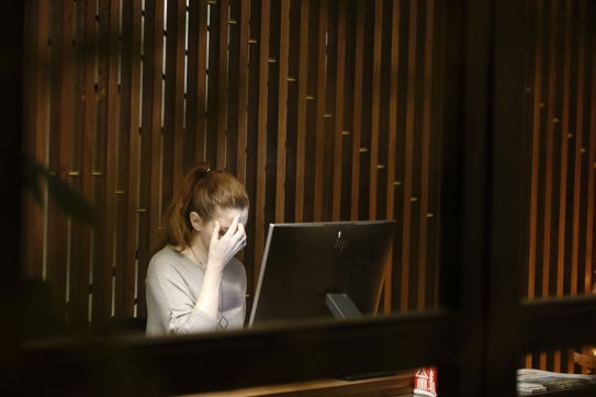 a-woman-sitting-in-front-of-a-laptop-computer.jpg a woman sitting in front of a laptop computer